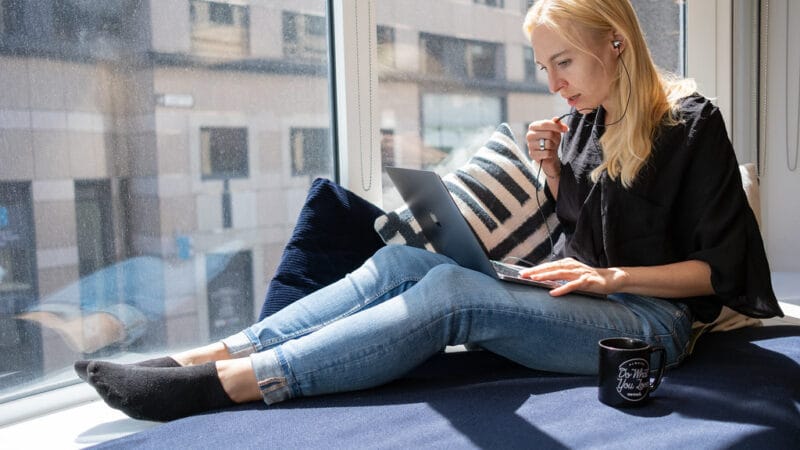 Solo founder working remotely on laptop planning a focused market strategy