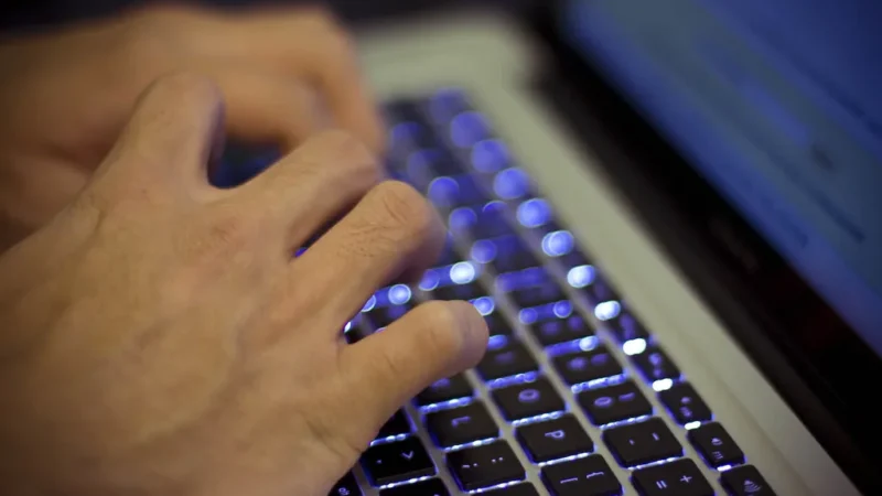 Developer laptop with code editor for founder learning to ship with AI tools