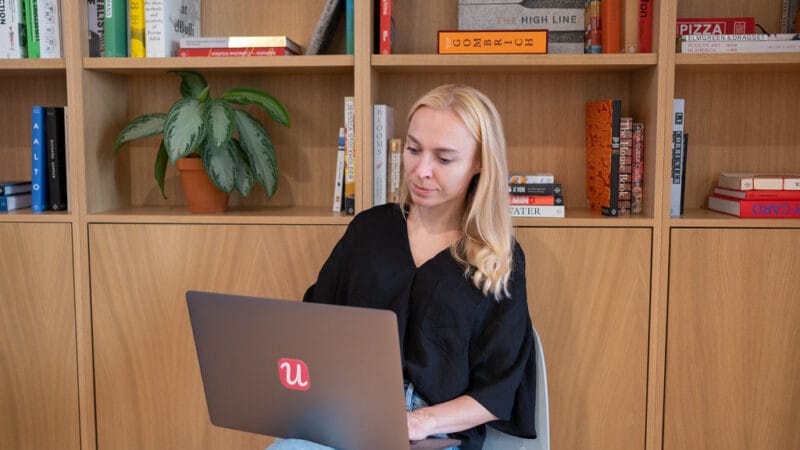 Founder working on laptop tracking free to paid conversion metrics for micro-SaaS