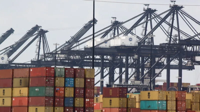 Shipping containers at US port representing import tariff exposure for small business operators in 2026
