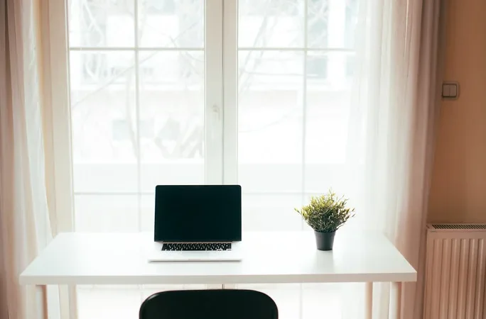 Minimal desk workspace with phone set aside for focused work