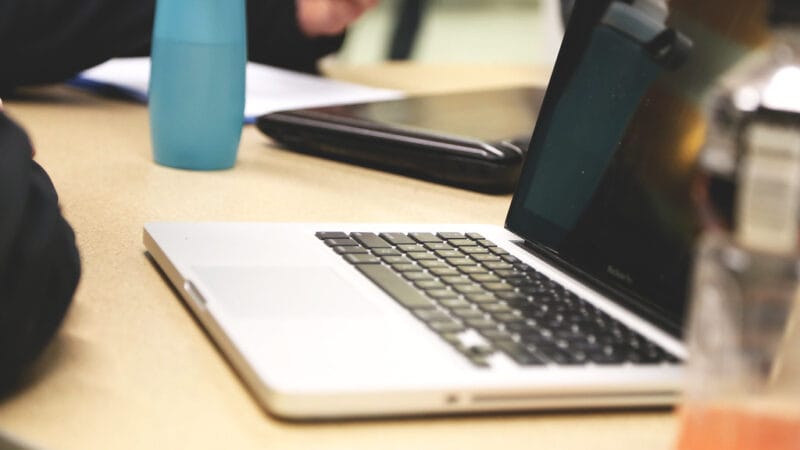founder laptop notebook startup workspace planning how to pre-sell a SaaS product