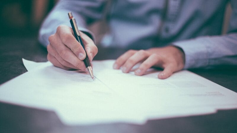 founder working at desk planning household finances and business strategy