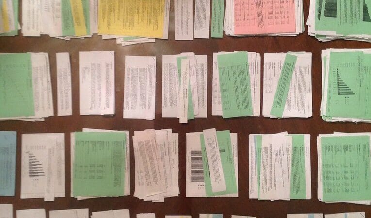 Founder reviewing startup business plan with pricing spreadsheet on desk